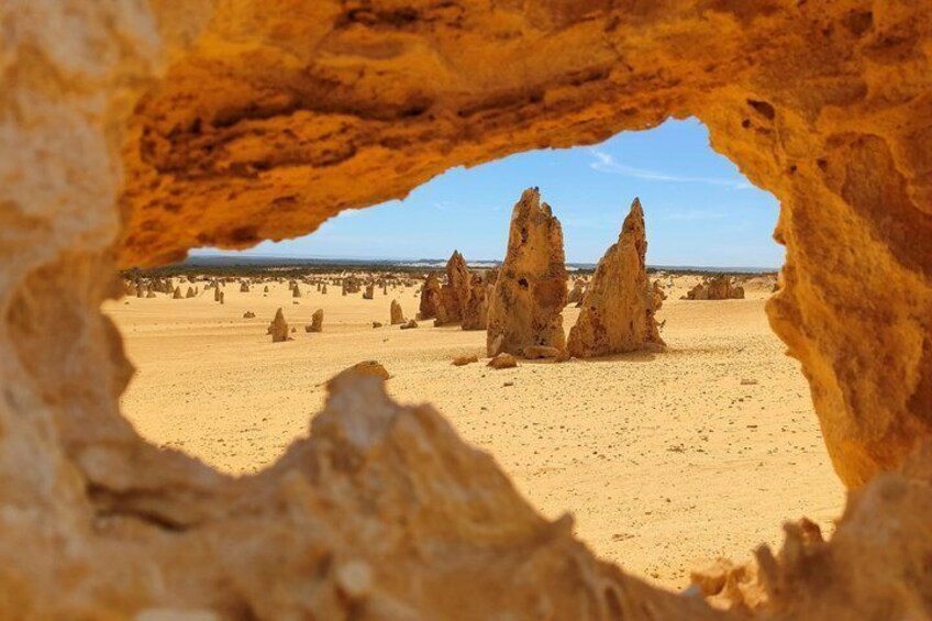A desert landscape with prominent rock formations. 1