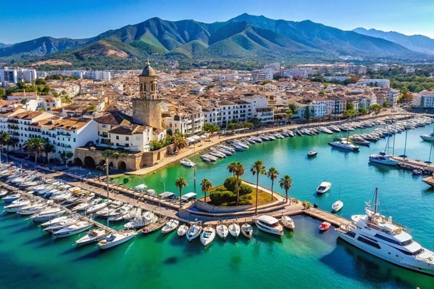 A coastal city with a marina, boats, and a prominent church. 1