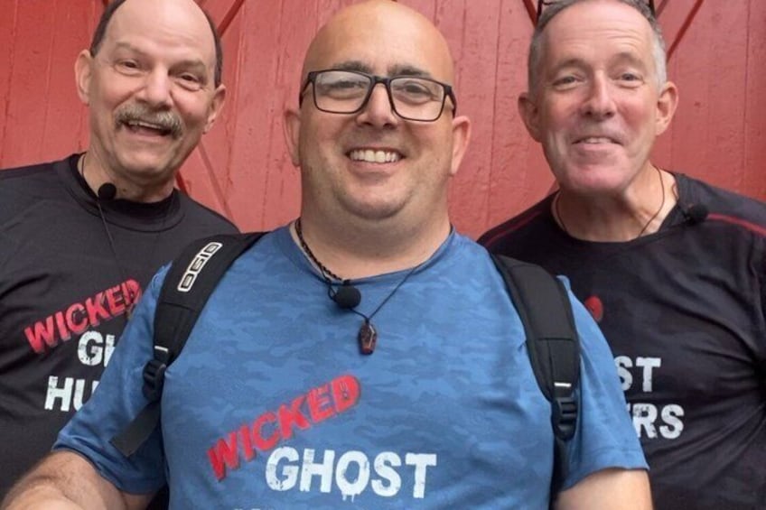 Three people wearing t-shirts with 'WICKED GHOST' printed on them. 2