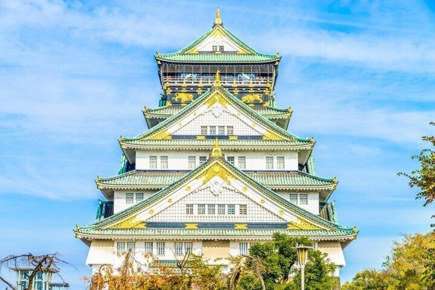A multi-tiered castle with traditional architecture, including ornate roofs and a prominent central tower. 3