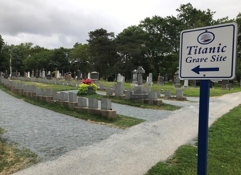 A cemetery with a sign indicating the Titanic Grave Site. 3