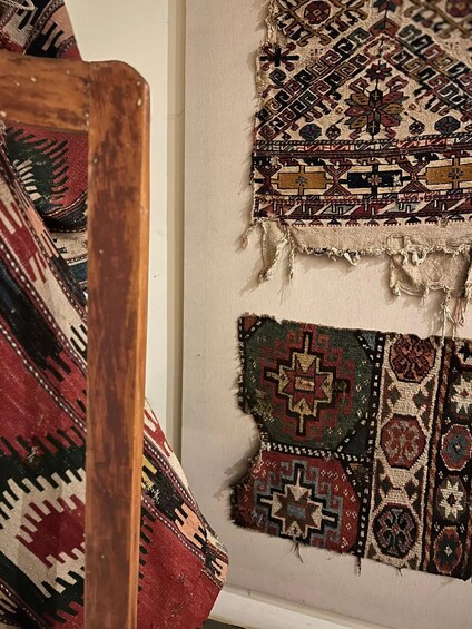 A collection of traditional woven rugs with intricate patterns and designs. 2