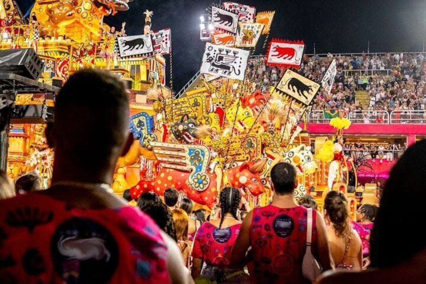 A brightly lit carnival with colorful decorations and signs. 4
