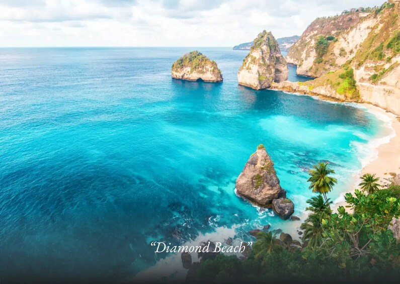 A coastal landscape with clear turquoise waters, rocky formations, and lush greenery. 4