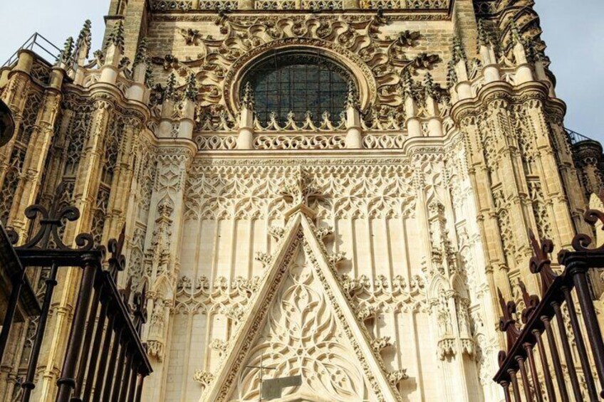 A detailed facade of a Gothic-style cathedral with intricate carvings and a large circular window. 2