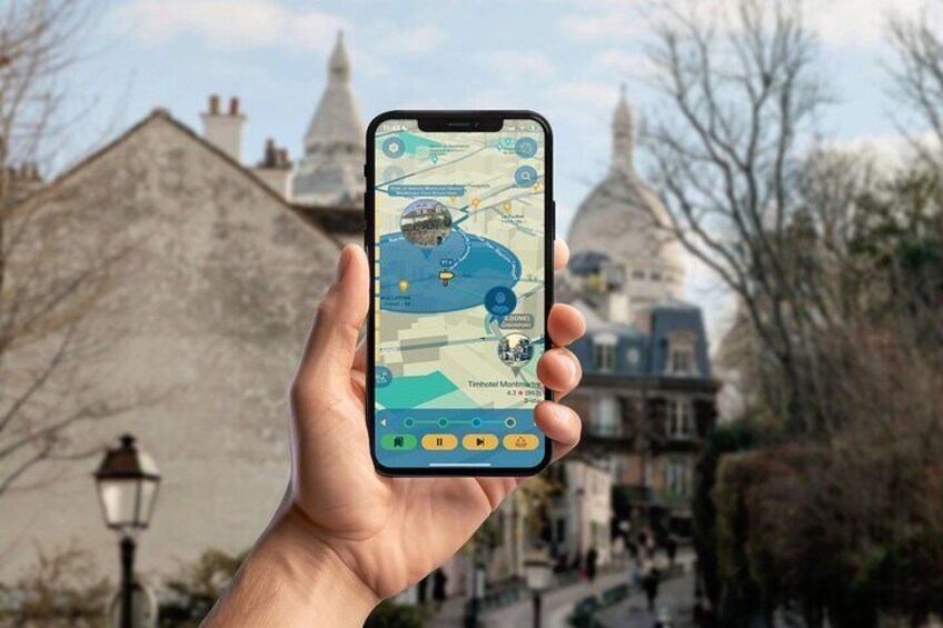 A hand holding a smartphone with a map application, displaying a location with a dome-shaped building in the background. 1
