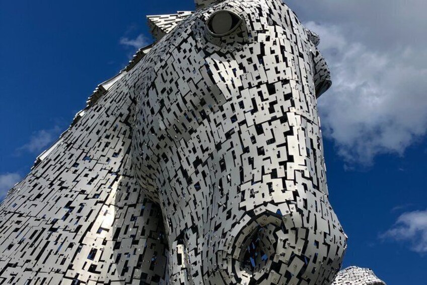 A large, intricate sculpture resembling a horse's head made of interlocking white blocks. 2