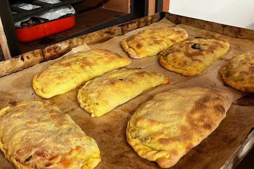 Golden-brown pastries on a baking tray. 1