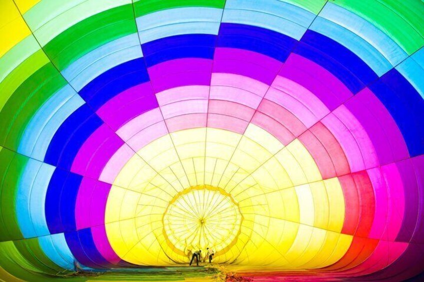 A hot air balloon with a multicolored canopy. 2
