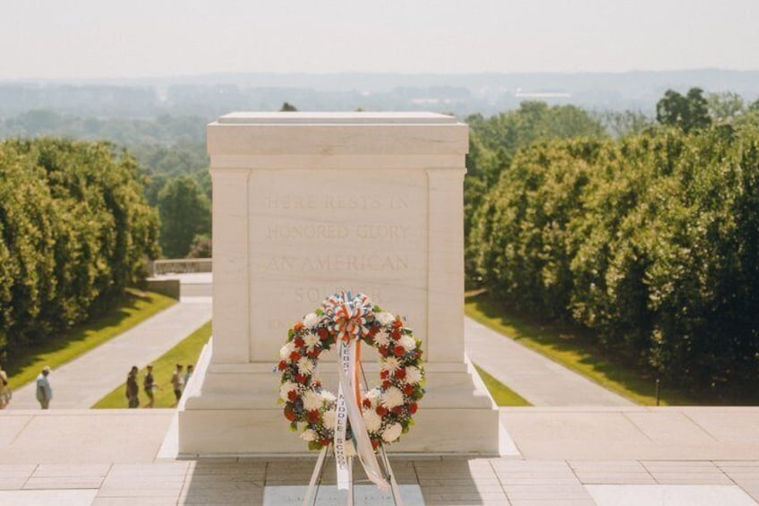 A memorial with a wreath and a clear view of the surrounding landscape. 4