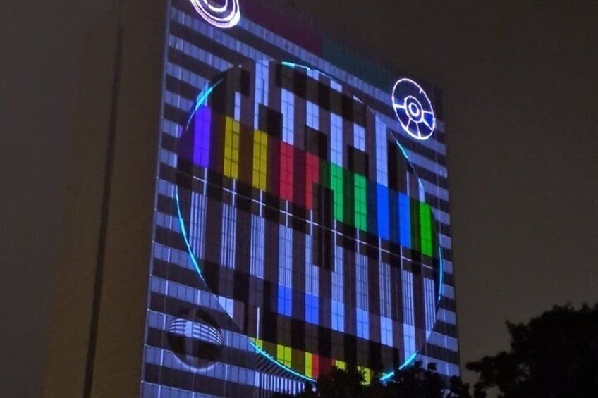 A building with a colorful light display. 5