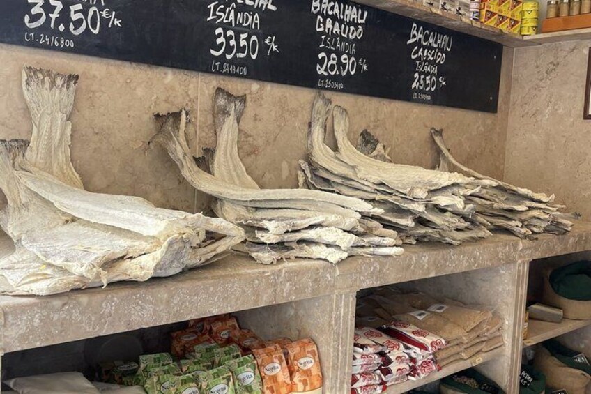 Dried fish on display with price tags. 5