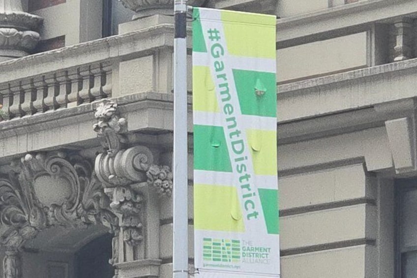 A banner with the text 'Garment District' and a logo. 4
