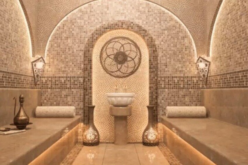 A spa with a central fountain, tiled walls, and arched ceilings. 2
