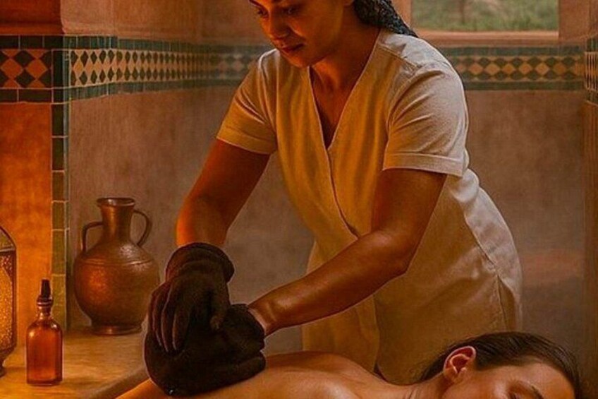 A person receiving a massage in a room with a tiled wall and a vase on the table. 5