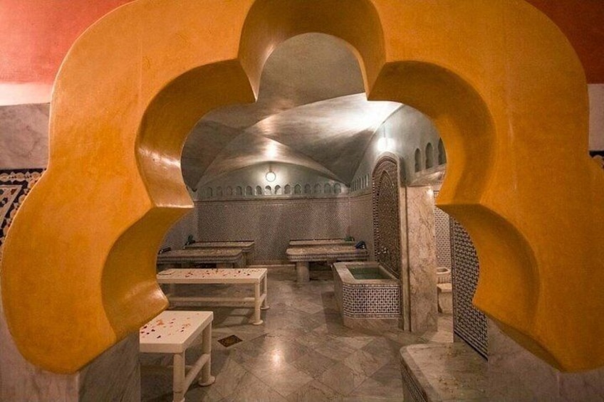 A sauna with benches and a large, abstract yellow structure in the foreground. 2