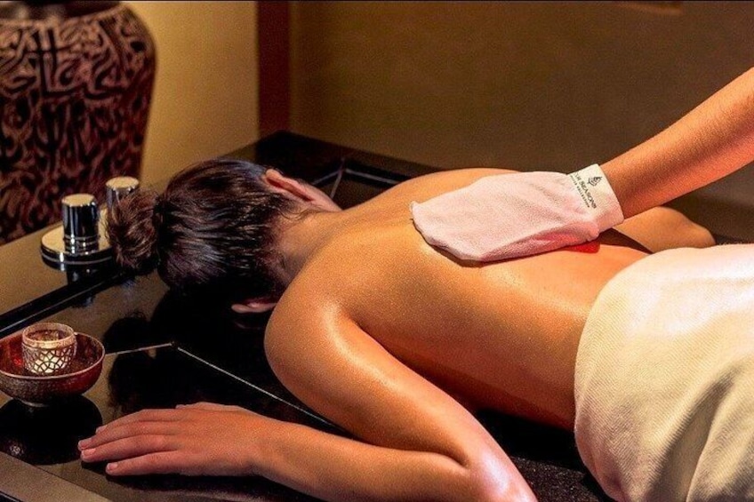 A person receiving a back massage. 1