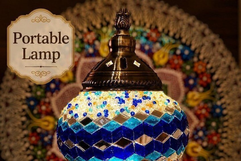 A decorative lamp with a patterned blue and yellow mosaic base and a metal top. 4