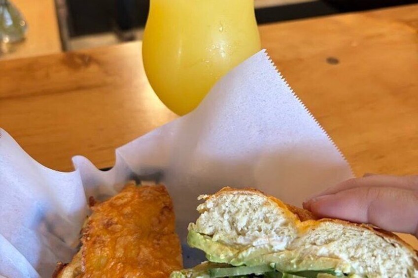 A sandwich with a side of fries and a drink on a table. 2