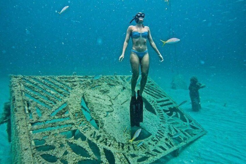A diver on a sunken shipwreck underwater. 1