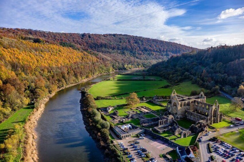 A river, a castle, and autumn foliage. 1