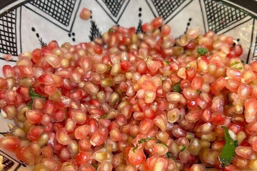 A bowl of pomegranate seeds. 5