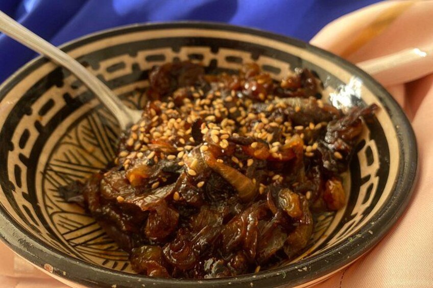 A bowl of food with sesame seeds on top. 4