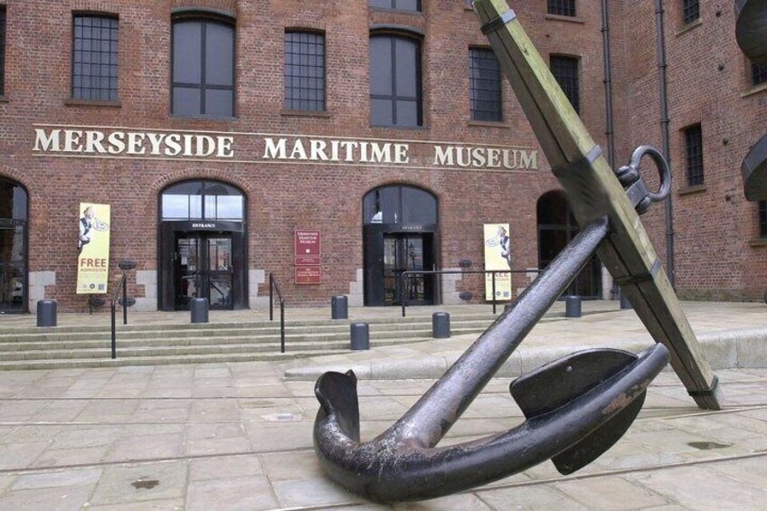 The Merseyside Maritime Museum with a large anchor sculpture in front. 2