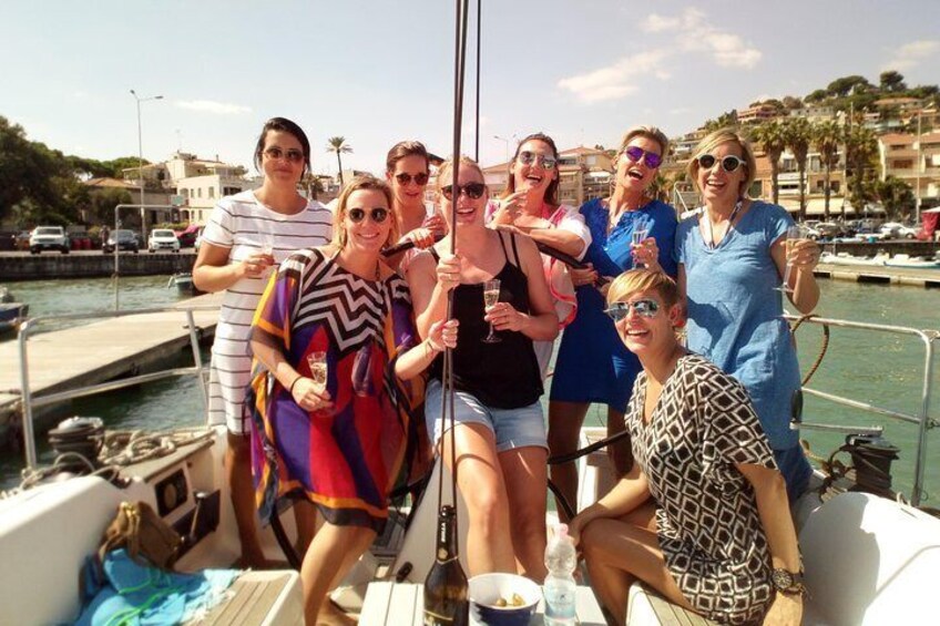 A group of people on a boat with a marina in the background. 3