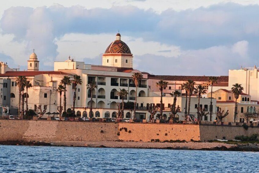 A coastal building with a dome, palm trees, and a waterfront. 2