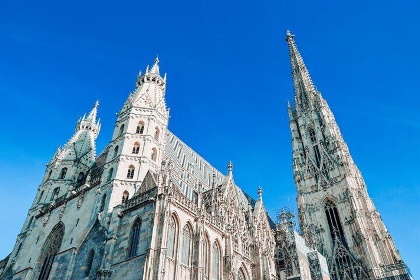 A Gothic cathedral with multiple spires and intricate stonework. 3