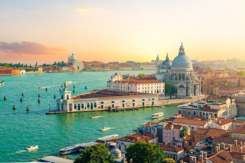 A river with boats, a prominent white building with a dome, and a cityscape with historical architecture. 1