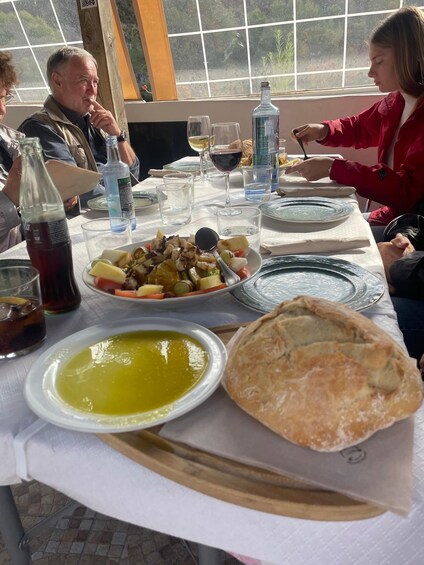A table with food, drinks, and a window view. 3