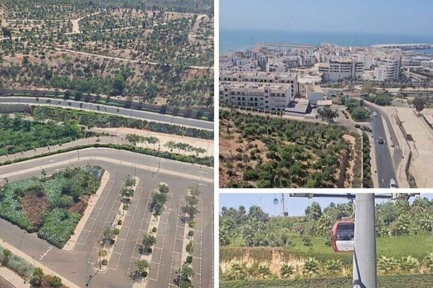 A coastal cityscape with a curved road, a parking lot, and a view of the sea. 2