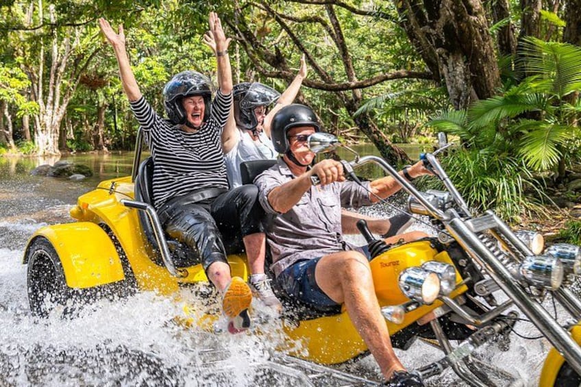 People on a yellow watercraft in a forested area. 5