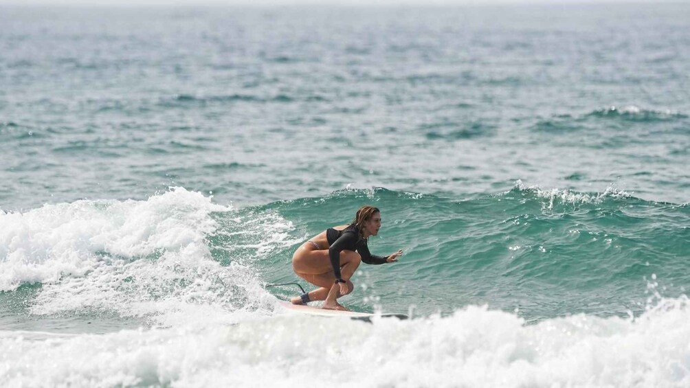 A person surfing a wave in the ocean. 1