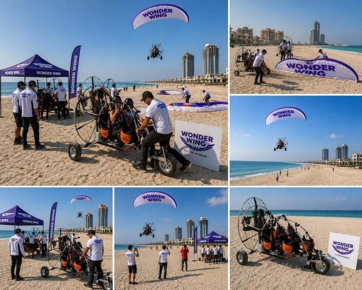 A beach event with a flying wing craft, tents, and a city skyline in the background. 5
