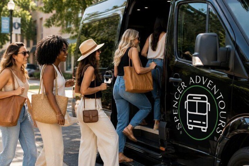 A group of people boarding a black van with 'SPENCER ADVENTURE' branding. 2