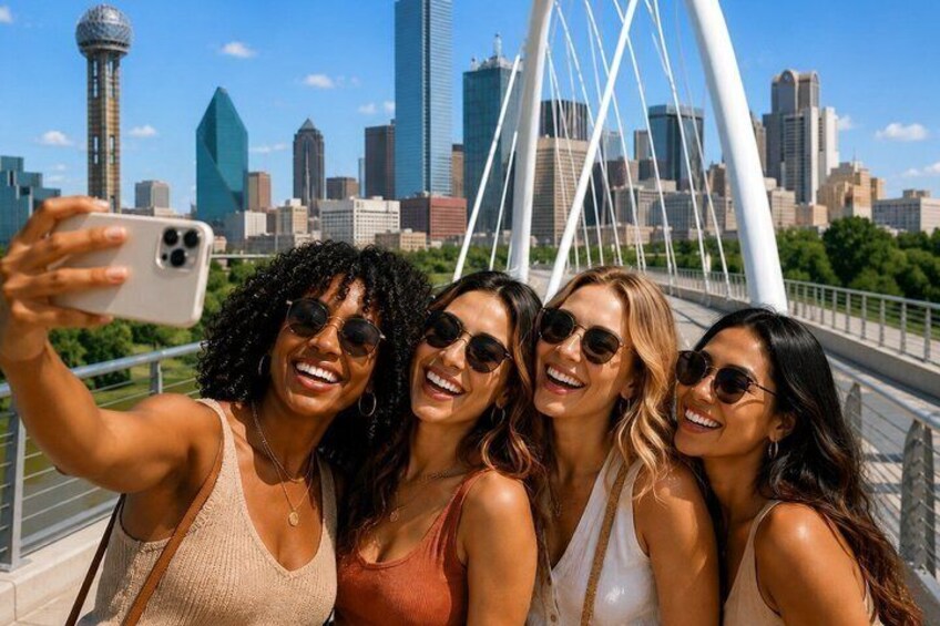 A group of people taking a selfie on a bridge with a city skyline in the background. 5