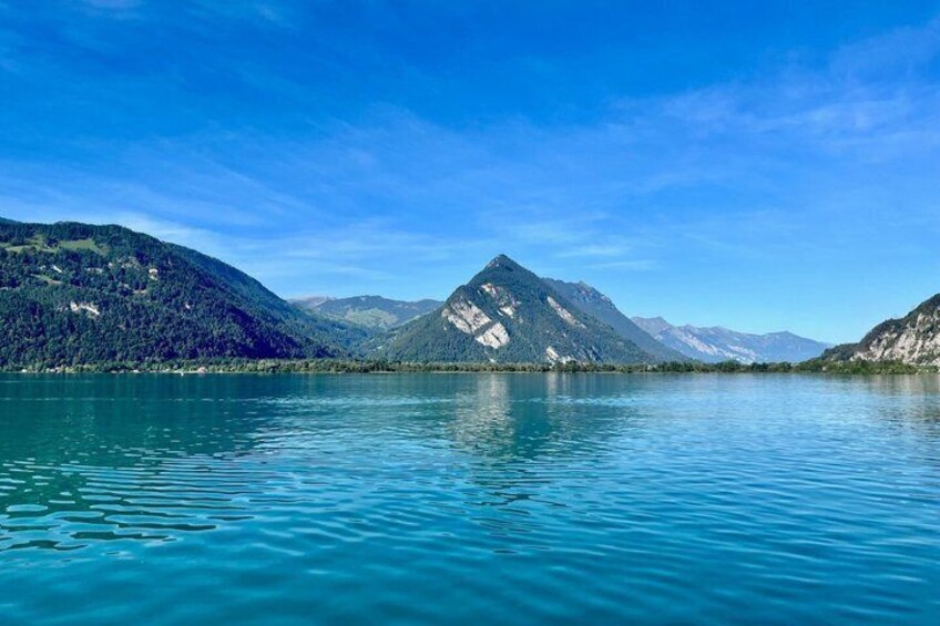 A calm lake surrounded by mountains. 5