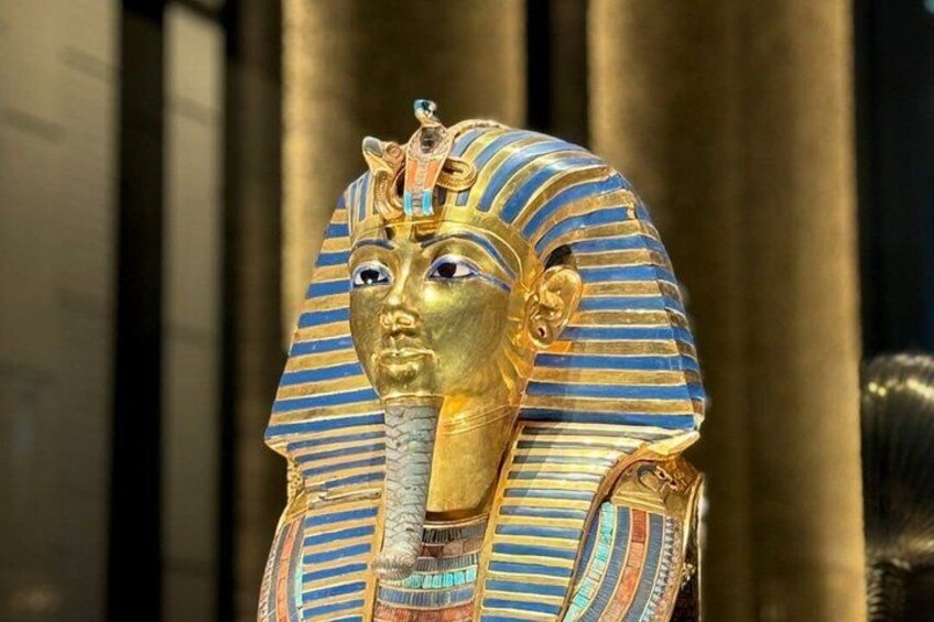 A golden statue with a striped headdress and a cobra head. 4
