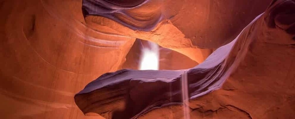 A canyon with a waterfall. 3