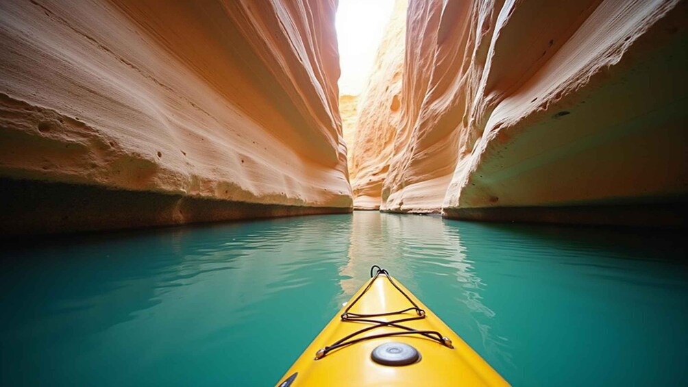 A kayak in a narrow water channel surrounded by rock walls. 1
