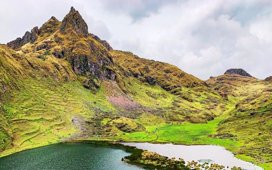A mountainous landscape with a lake and a small island. 1