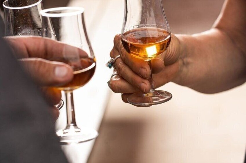 Two people holding wine glasses. 2