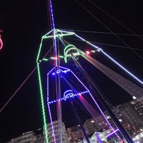 A bridge with colorful lights at night. 5