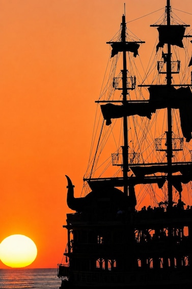A ship silhouette against a sunset. 3
