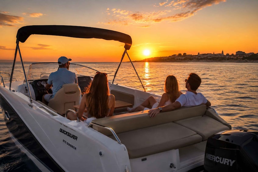 A boat with a 'QUICKSILVER' label, a 'MERCURY' motor, and a sunset over water. 4