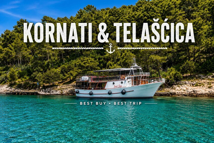 A boat named 'Sveti Sime' on clear turquoise water with a backdrop of green trees and rocky shore. 1