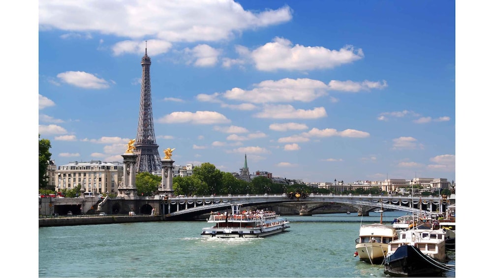 The Eiffel Tower, a river, and a bridge in Paris. 3